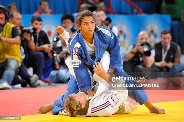 Sarah Menezes of Brazil fights against Frederique Jossinet of France during the bronze medal match of the women's 48kg category of the World Judo...