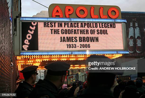 The marguee at the Apollo Theater announces James Brown's death. Thousands of James Brown fans stood in line to pay homage to the legendary...