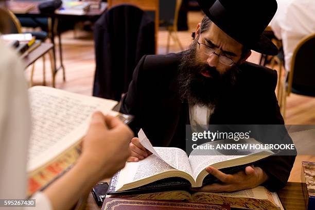 Orthodox Jewish scholars study the Talmud at the Yeshiva Kol Yaakov in Monsey, New York.