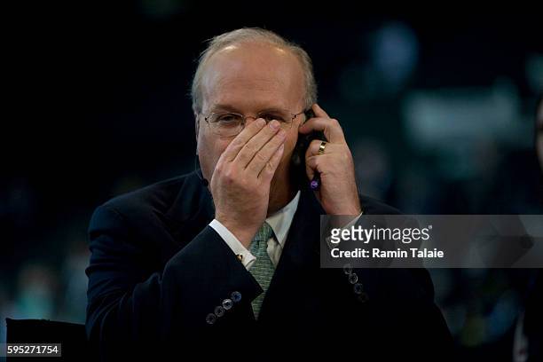 Karl Rove, former White House advisor and current TV commentator speaks into his cell phone on the set Fox News on the second day of the Republican...
