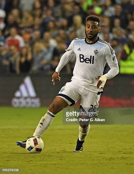 Forward Giles Barnes of the Vancouver Whitecaps FC dribbles the ball up the field against Sporting Kansas City during the first half on August 20,...