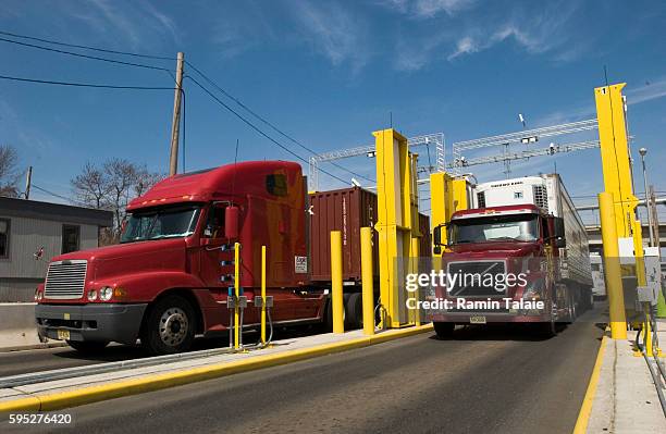 Container trucks drive through an Advanced Spectroscopic Portal while exiting the New York Container Terminal in Staten Island, New York. The...