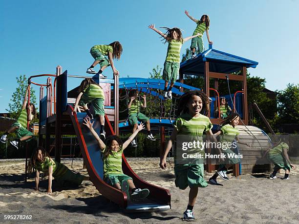 boy playing on jungle gym - wiederholung stock-fotos und bilder