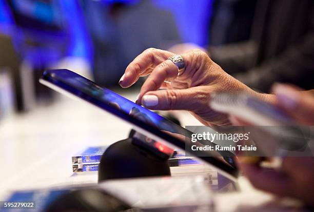 Woman uses a Samsung Galaxy Tab, a 7-inch touchscreen mobile tablet, with the Android 2.2 operating system, during a news conference in New York, on...