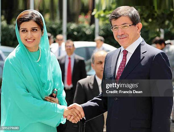 Foreign Minister of Turkey Prof. Dr. Ahmed Davutoglu welcoming the Foreign Minister Ms Hina Rabbani Khar at Ankara on 11 August 2011. | Location:...