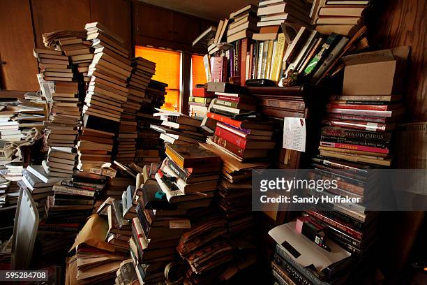 View of a bedroom filled with books and other items at a hoarders home in San Diego, California on Friday, April 8, 2011. Greg Martin's mother was a...