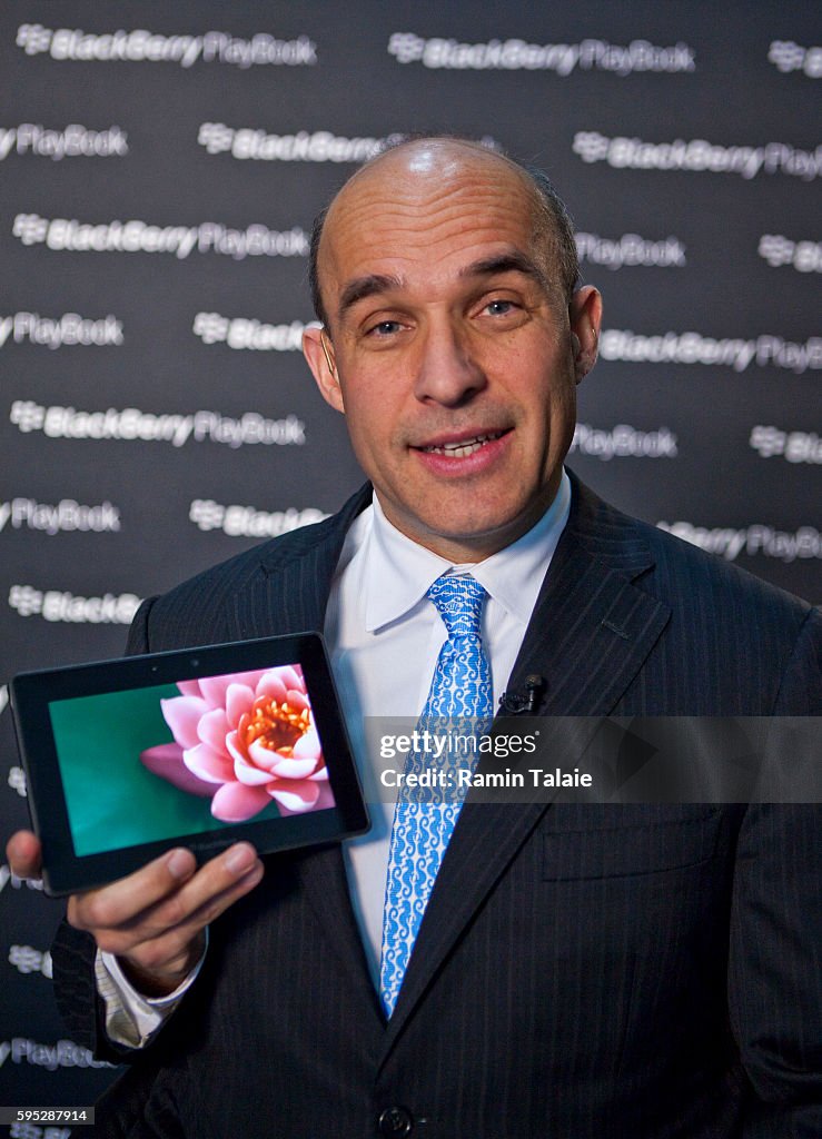 Jim Balsillie, CoCEO of Research In Motion Ltd. , holds up the... News