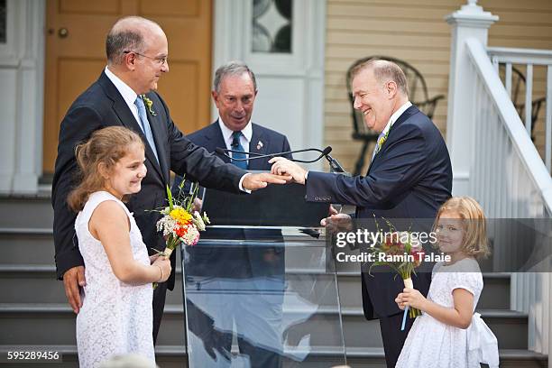 New York City Mayor, Michael Bloomberg officiates over the same-sex wedding of Jonathan Mintz , New York City's consumer affairs commissioner, and...