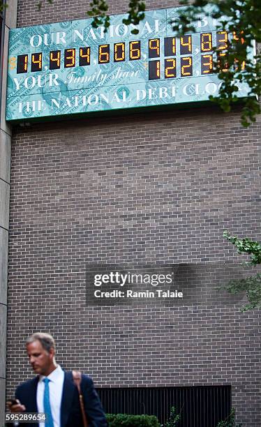 The National Debt Clock billboard is displayed on a building in midtown Manhattan on August 2, 2011 in the New York City. The national debt exceeds...