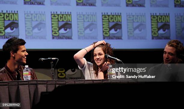 Actor's Taylor Laughtner, Kristen Stewart and Robert Pattinson speak during a panel discussion for the movie The Twilight Saga: Breaking Dawn at Hall...