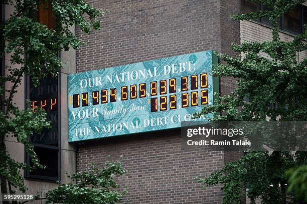 The National Debt Clock billboard is displayed on a building in midtown Manhattan on August 2, 2011 in the New York City. The national debt exceeds...