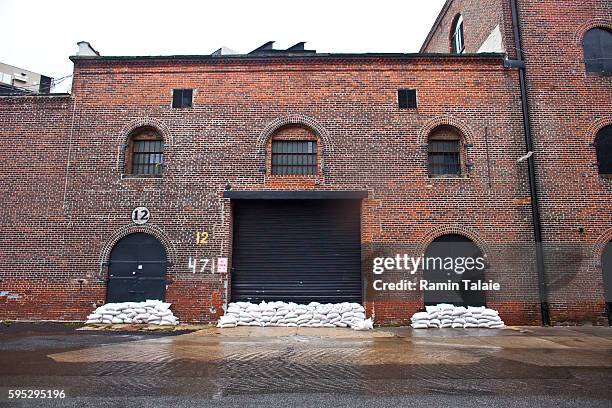 Sandbags cover the entrance of a warehouse in a flooded street in Red Hook section of Brooklyn after hurricane Irene made landfall in New York City...