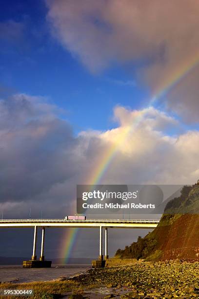 rainbow and lorry on the severn bridge - delivery truck stock pictures, royalty-free photos & images