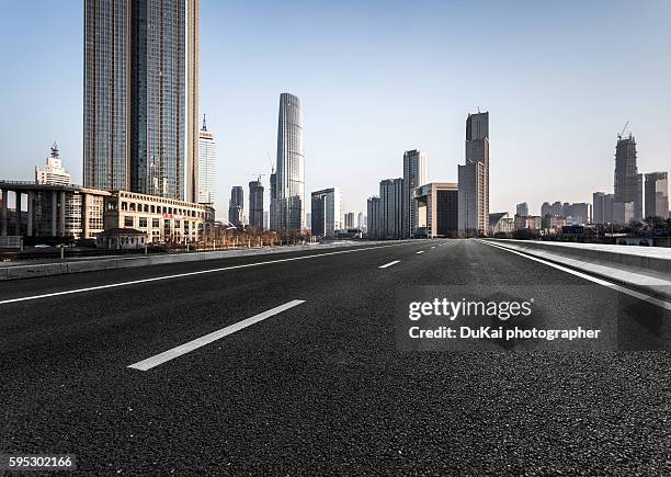 empty road in tianjin - asphalt paver stock pictures, royalty-free photos & images