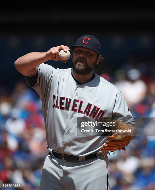 Joba Chamberlain of the Cleveland Indians gets set before delivering a pitch in the fifth inning during MLB game action against the Toronto Blue Jays...