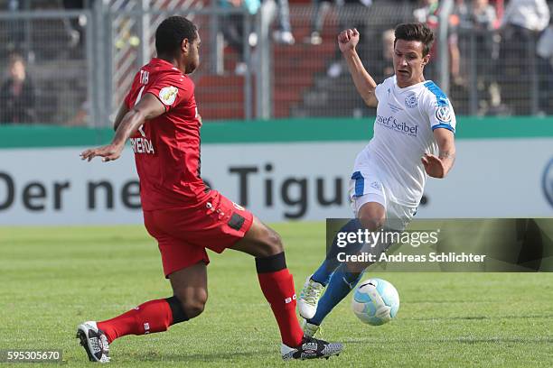 Jesper Brechtel of SC Hauenstein challenges Jonathan Tah of Bayer Leverkusen during the DFB Cup match between SC Hauenstein and Bayer 04 Leverkusen...