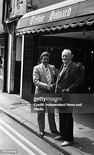 Actor Trevor Howard with Paul Reid Managing Director of "Trevor Howard" Mens' shop, Duke Lane, Dublin, .