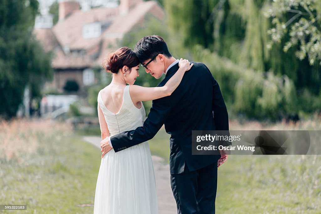 Young couple walking in garden