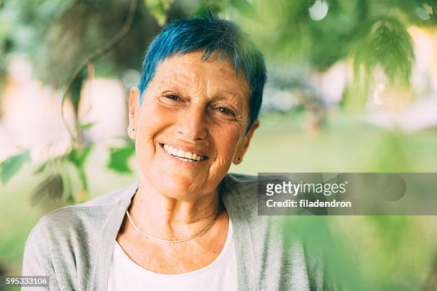 happy senior woman - older woman colored hair stock pictures, royalty-free photos & images