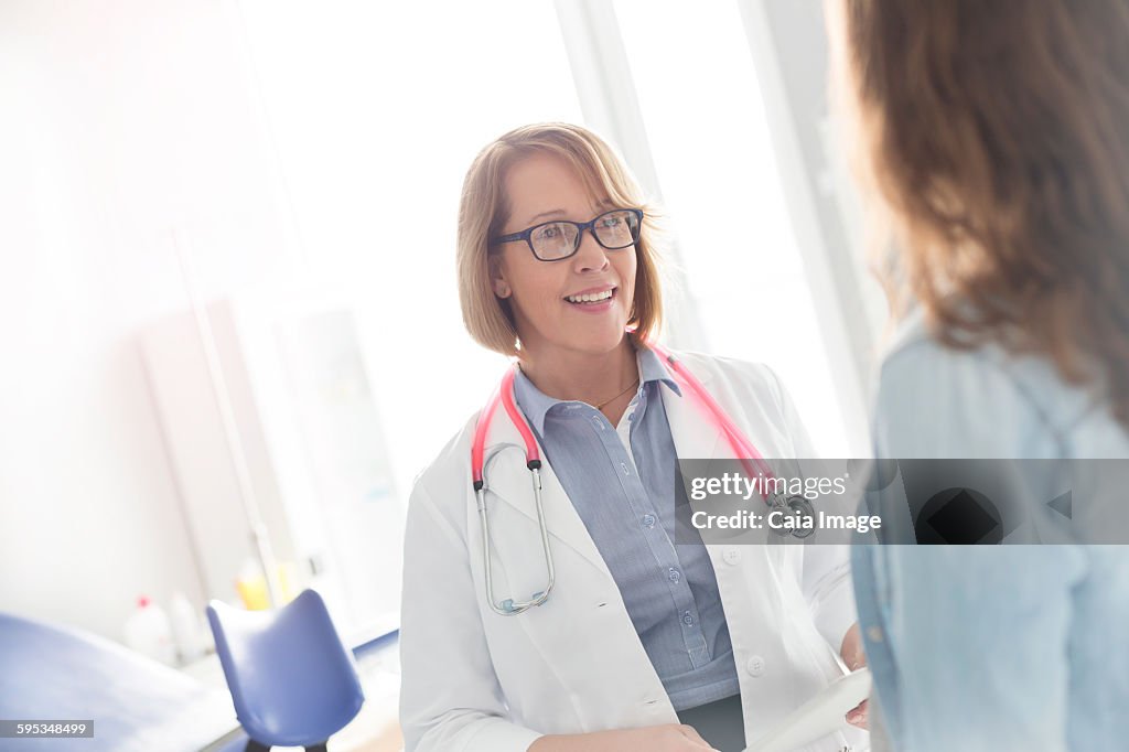 Doctor and patient talking in examination room