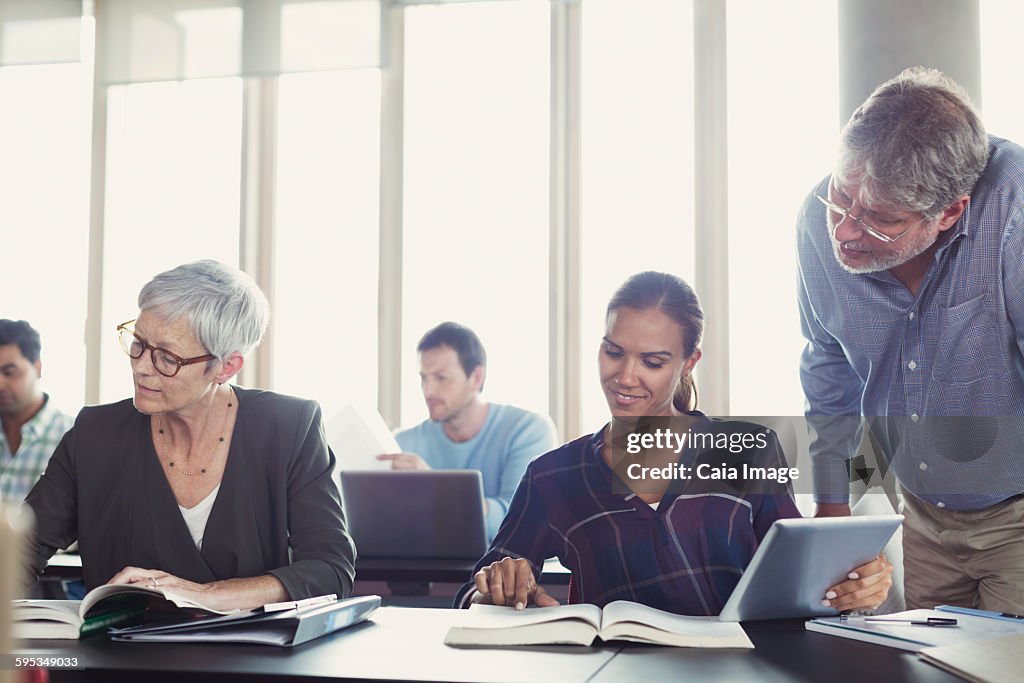 Students studying in adult education classroom