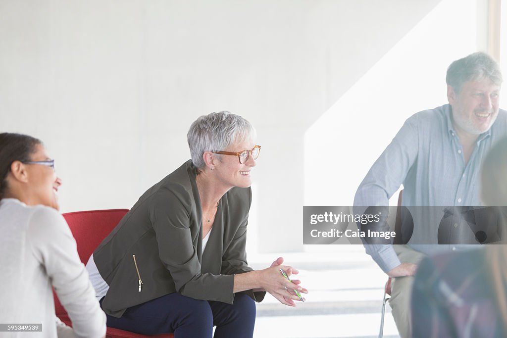 Smiling business people in meeting