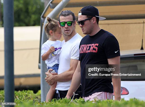 Part of this image has been pixellated to obscure the identity of the child) Real Madrid football player Gareth Bale and his daughter Alba Violet...