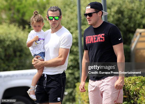 Part of this image has been pixellated to obscure the identity of the child) Real Madrid football player Gareth Bale and his daughter Alba Violet...