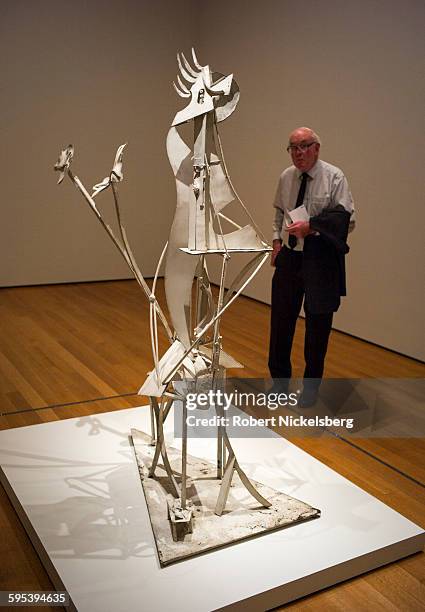 Man looks at a metal sculpture, entitled 'Woman in the Garden' , at the Museum of Modern Art, New York, New York, October 27, 2015.