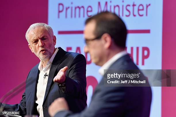 Jeremy Corbyn gestures as Owen Smith looks on during a Labour Party leadership debate on August 25, 2016 in Glasgow,Scotland. Jeremy Corbyn and Owen...