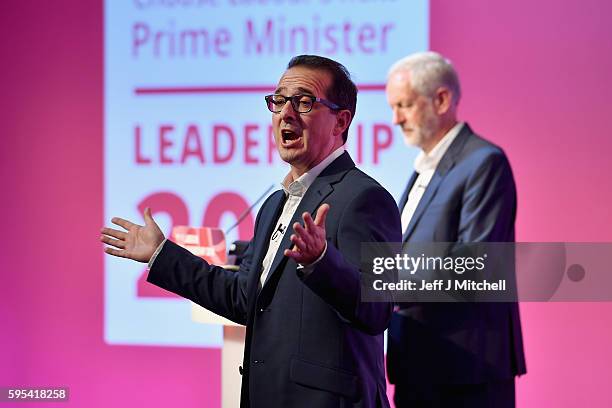 Jeremy Corbyn listens to Owen Smith sum up at the Labour Party leadership debate on August 25, 2016 in Glasgow, Scotland. Jeremy Corbyn and Owen...