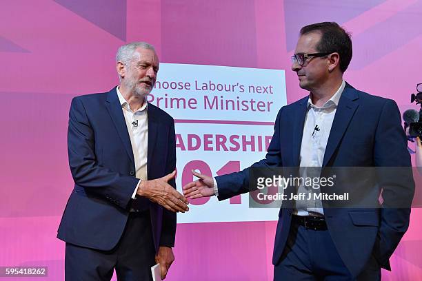 Jeremy Corbyn and Owen Smith shake hands following a Labour Party leadership debate on August 25, 2016 in Glasgow, Scotland. Jeremy Corbyn and Owen...