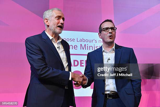 Jeremy Corbyn and Owen Smith shake hands following a Labour Party leadership debate on August 25, 2016 in Glasgow, Scotland. Jeremy Corbyn and Owen...