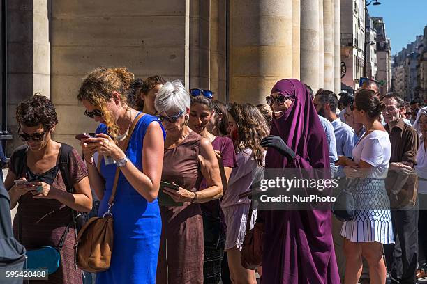 Protesters from different societies stage outside the Council of State in France in Paris on 25 August 2016 to show support for Muslim women after 15...