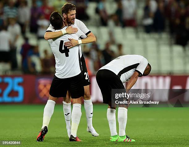 Fabricio Silva Dornellas and Florin Lovin of FC Astra Giurgiu celebrate following the UEFA Europa League match between West Ham United and FC Astra...