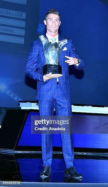 Real Madrid's Portuguese player Cristiano Ronaldo poses with his trophy of Best Men's player in Europe at the end of the UEFA Champions League Group...