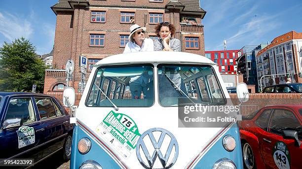 Austrian actor Fritz Karl and german actress Elena Uhlig attend the first day of the Hamburg-Berlin Klassik Rallye on August 25, 2016 in Hamburg,...