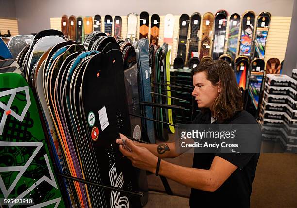 August 25: Colorado Ski and Golf sale associate Tucker Means organizes snowboards for the annual Ski Rex sale August 25, 2016. The sale starts...