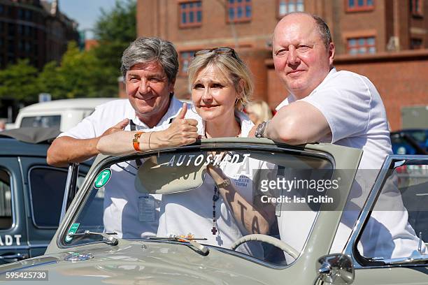 Former race driver Christian Geistdoerfer, german actress Katharina Schubert and Otto Ferdinand Wachs, CEO Autostadt GmbH attend the first day of the...