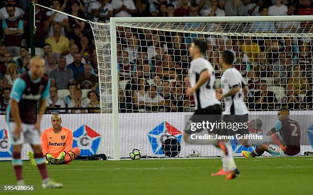 Darren Randolph of West Ham United and Winston Reid show their disappointment during the UEFA Europa Play-Off Second leg match between West Ham...