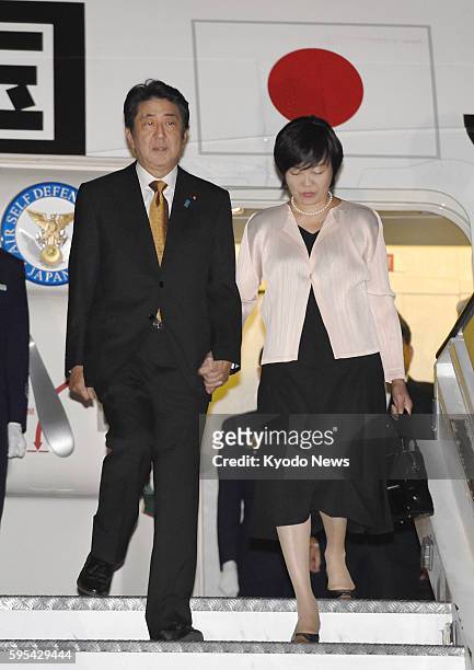 Japan's Prime Minister Shinzo Abe and his wife Akie arrive in Nairobi, Kenya, on Aug. 25, 2016. Abe is scheduled to attend a Japan-led African...