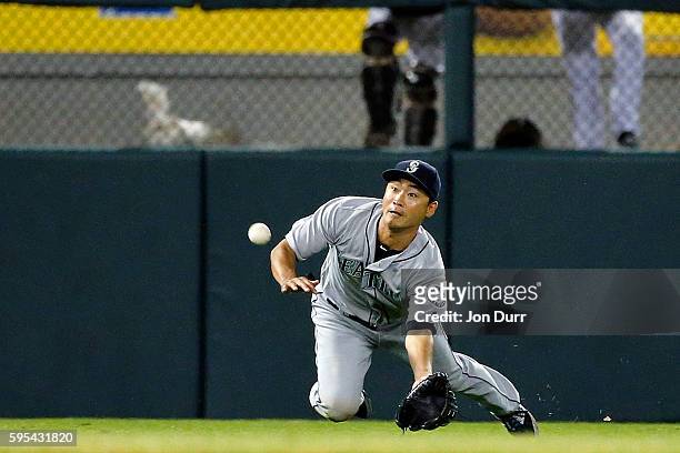 Norichika Aoki of the Seattle Mariners makes a diving catch for an out against the Chicago White Sox during the seventh inning at U.S. Cellular Field...