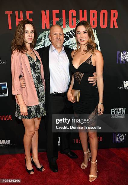 Actress Alex Essoe, executive producer Tony Sgro and actress Melissa Bolona arrive at the premiere of "The Neighbor" at Brenden Theaters at Palms...