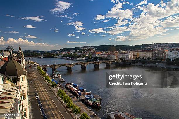 the vltava river and a bridge in prague at sunset, czech republic, europe - tancici dum stock pictures, royalty-free photos & images