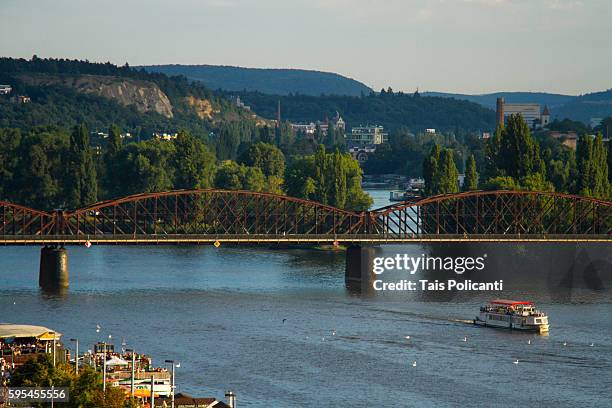 a cruise at the vltava river crossing the zeleznicni bridge (železniční most) in prague, czech republic, europe - the moldau river stock pictures, royalty-free photos & images