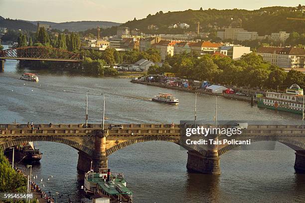 a cruise at the vltava river crossing the palacký bridge (1876) in prague, czech republic, europe - tancici dum stock pictures, royalty-free photos & images