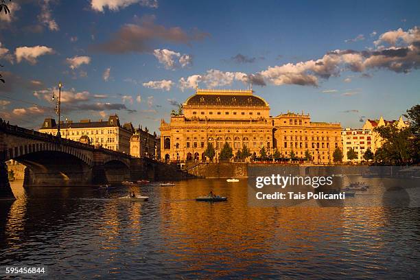 the national theatre (národní divadlo) reflected in the vltava river at sunset in prague, czech republic, europe - the moldau river stock pictures, royalty-free photos & images