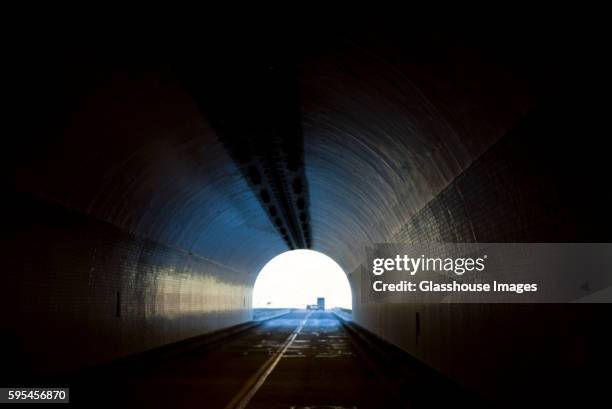 light at end of tunnel - luce alla fine del tunnel foto e immagini stock