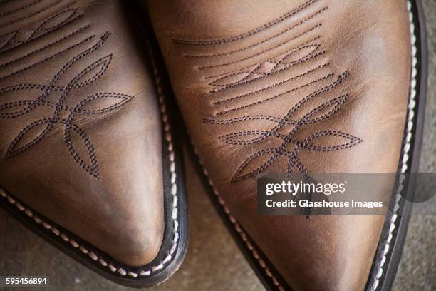 brown cowboys boots, detail - leather shoe stock pictures, royalty-free photos & images