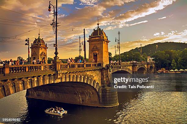 sunset at bridge of the legions (most legii) at the vltava river in prague, czech republic, europe - tancici dum stock pictures, royalty-free photos & images